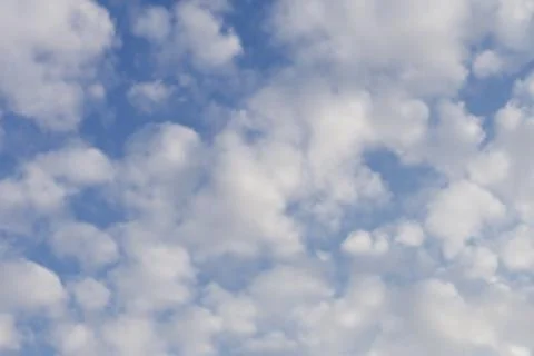 Heart clouds on blue sky. Cloudy day. Stock Photos