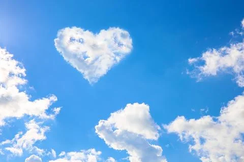 A heart of clouds in the sky. Stock Photos