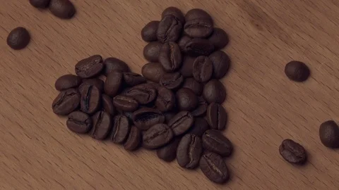 Heart of coffee beans rotates Stock Footage 105038506
