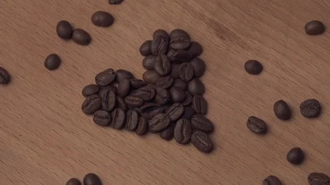 Heart of coffee beans rotates Stock Footage 105038509