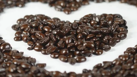 Heart of coffee beans on the table Video stock 72722456