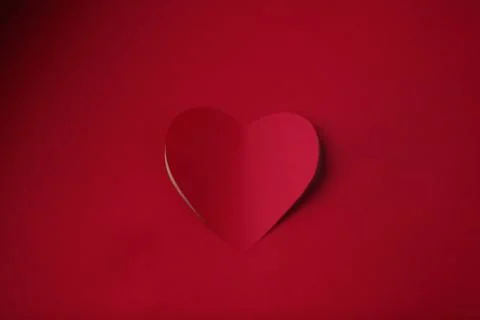 Heart cut in paper background Stock-Fotos