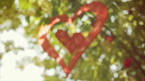 Heart decoration hanging on the tree Stock Footage