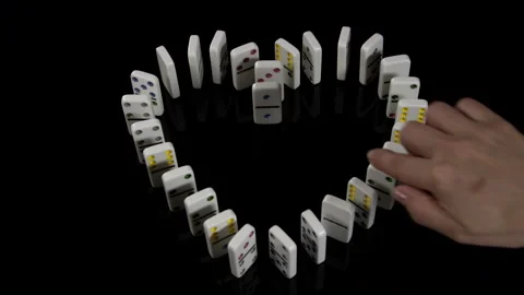 Heart Of Dominoes on a black table Stock Footage 243414834