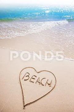 Heart drawing on beach Stock Photos