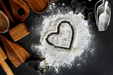 Heart Drawn in Baking Flour with Baking Supplies Border Stock Photos