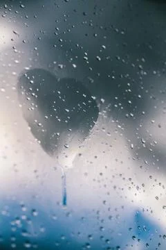 Heart drawn on window Stock Photos