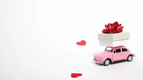 Heart falls on a typewriter delivering a gift on a white background, Valentine's Stock Footage 170185196