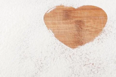 Heart in flour closeup Stock Photos