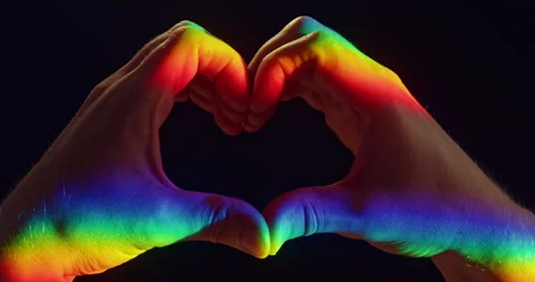 Heart Gesture with Two Hands in Rainbow Light on Black Background Stock Footage 347832687