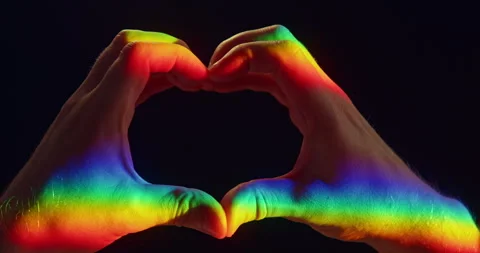 Heart Gesture with Two Hands in Rainbow Light on Black Background Stock Footage 347832893