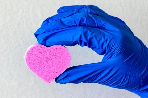 Heart in the hand light background. Stock Photos