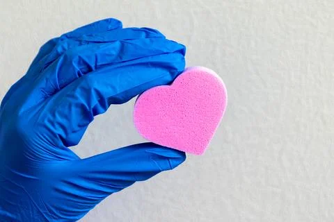 Heart in the hand light background. Stock Photos
