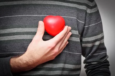 Heart in a hand Stock Photos
