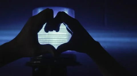 Heart Hands Blue Light Stock Footage 10772296