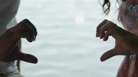 Heart of hands of Lovers Connect on a background of Water Stock Footage 68084139