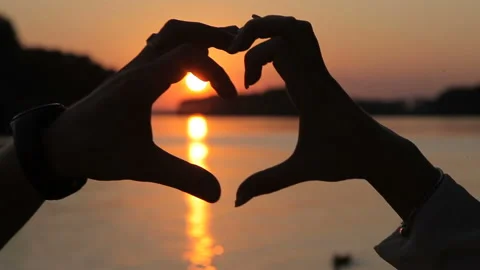 Heart from the hands of a loving couple Stock Footage 93736690