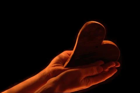 Heart in hands Stock Photos