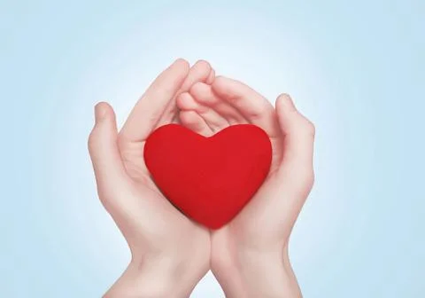 Heart in hands Stock Photos