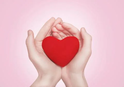 Heart in hands Stock Photos
