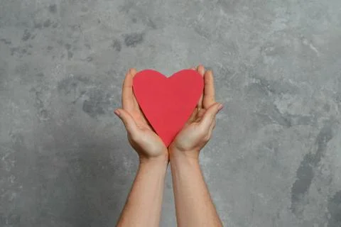 Heart in hands Stock Photos
