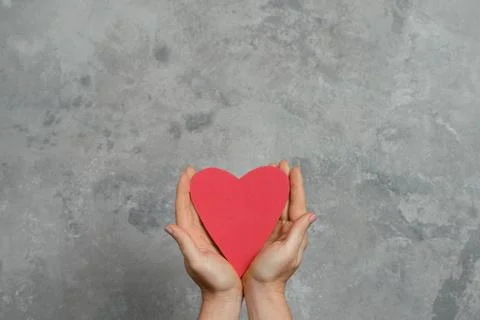 Heart in hands Stock Photos