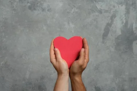 Heart in hands Stock Photos