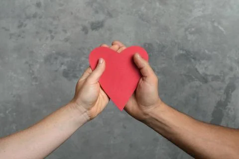 Heart in hands Stock Photos