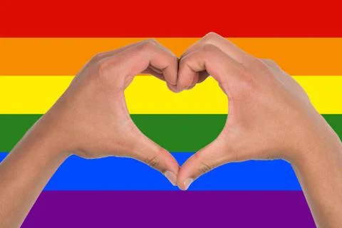 Heart of hands on a rainbow flag Foto stock