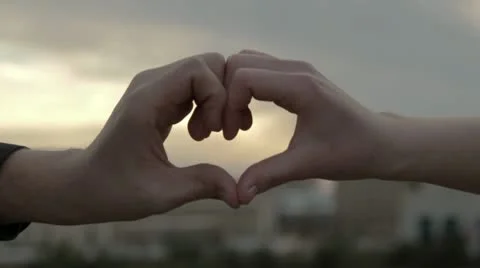 Heart Hands at Sunset Stock Footage 10772659