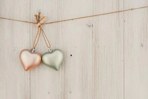 Heart hanging on the clothesline. On old wood background 스톡 사진