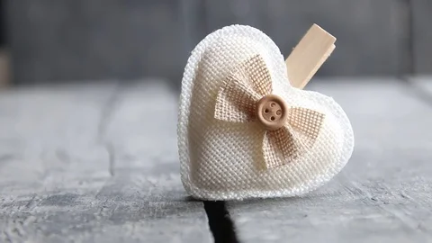 Heart hanging on rope Stock Footage