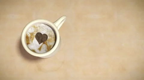 A heart has been created in the foam of a cup of coffee Stock Footage 47331516