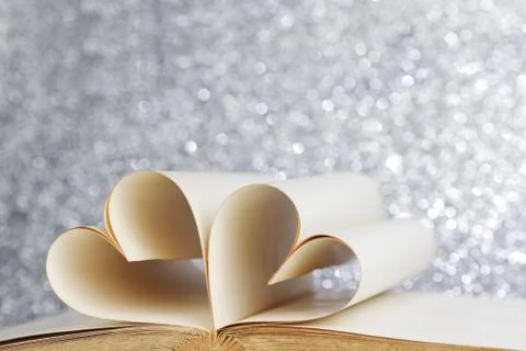 Heart inside a book Stock Photos