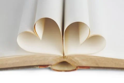 Heart inside a book Stock Photos