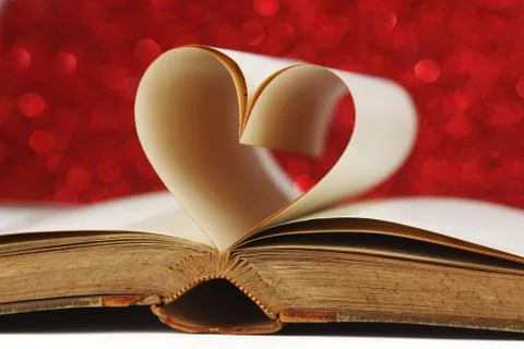 Heart inside a book Stock Photos