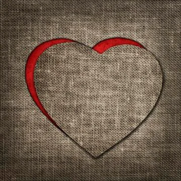Heart of linen fabric with red substrate Stock Photos