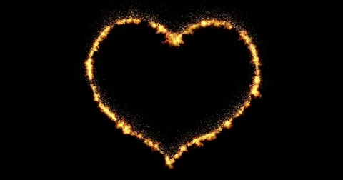 Heart made by burning flames flowing on black background with fire particle Видео 72237549