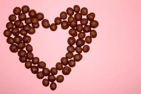 Heart made of chocolate shells Stock Photos