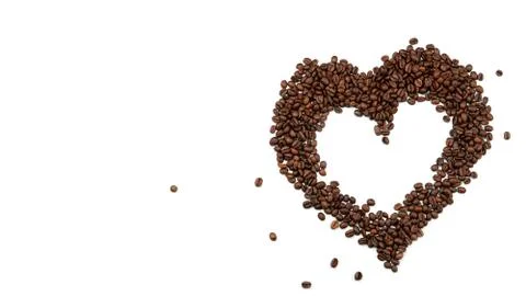 Heart made of coffee beans on a white background. Stock Photos