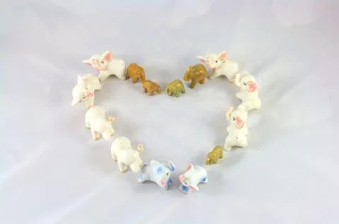 Heart made from elephants on sheet Stock Photos