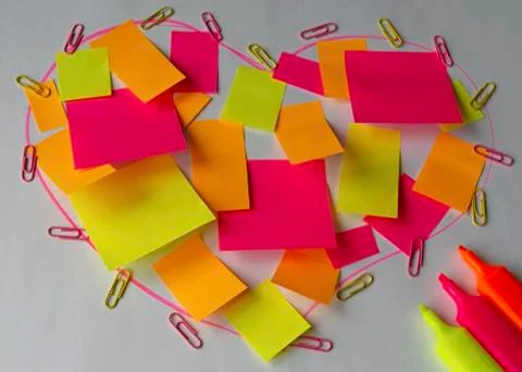 Heart made of multi-colored office stickers, next to multi-colored markers Stock Illustration