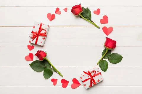 Heart made of rose, git box, heart and blank greeting card mockup on Colored  写真素材