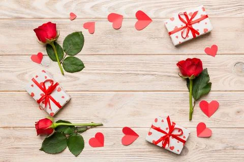 Heart made of rose, git box, heart and blank greeting card mockup on Colored  Fotos de archivo
