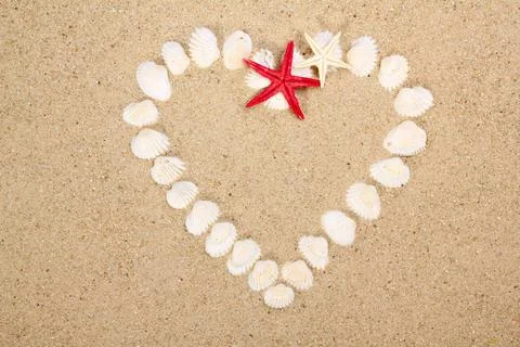 Heart made with shells. Heart shape on sand heart made with shells. Heart ... Stock-Fotos