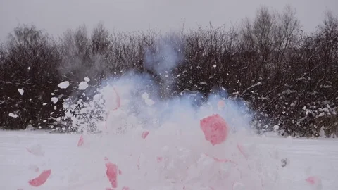 Heart made from snow explode and fly apart, slow motion shot Stock Footage 85362479