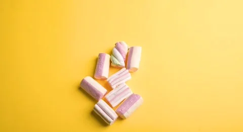 Heart from marshmallows sweets on a yellow background. STOP MUSH. Sweet gift Stock Footage 144823800
