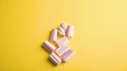 Heart from marshmallows sweets on a yellow background. STOP MUSH. Sweet gift Stock Footage 151930105