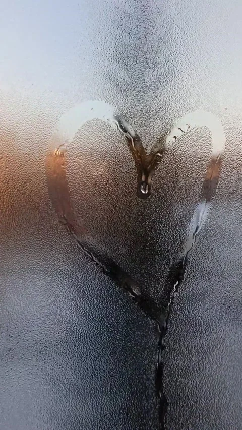 Heart on a misted window Stock Footage 221320613