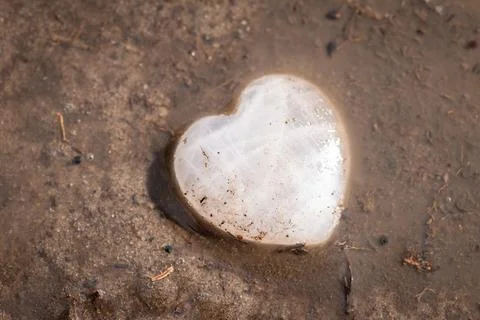 Heart in mud Stock Photos